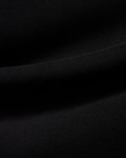 Men's Samson Quarter-Zip Sweater in classic black, crafted from a soft, smooth jersey knit fabric, showcasing its premium texture with subtle folds. (6)