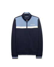 Men's Jacques Pique Track Jacket, navy pique with light blue upper and white stripe. Classic fit, full zip with bunny skull pull, ribbed trim, and embroidered Psycho Bunny script logo on chest. (6)