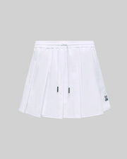 Womens Cecilia Sport Skort, white pleated design with an elastic drawstring waist, green metal tips, and a small embroidered Psycho Bunny skull logo on the right hem.